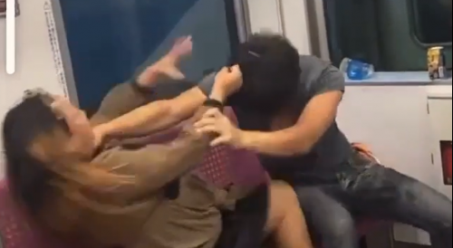 Couple Fighting On The Subway Train In Japan