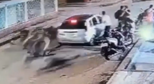 Car runs over motorcyclist