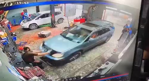 Female Driver Crushes Mechanic In Russia