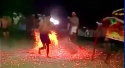 Indian Men Celebrating With Hot Coals.