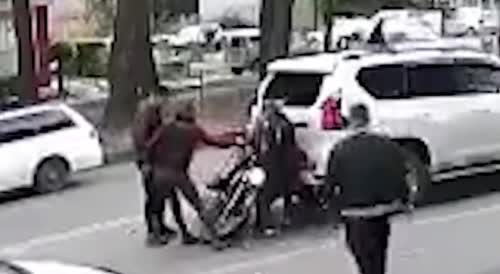 Biker Gets Beaten After Crashing Into The SUV In Russia