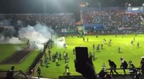 Football fans riot on the field in Indonesia