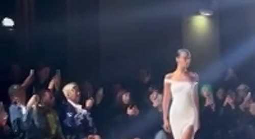 Bella Hadid is sprayed into gown as Kylie takes in Coperni show