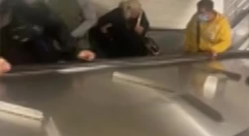 Two men brawl in Grand Central Station and tumble down escalator