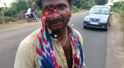 Indian man crashes his bike.