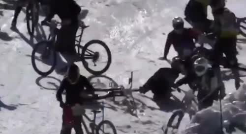 Hundreds Of Bike Riders Hurtle Down An Icy Cliff And Crash Into One Another.