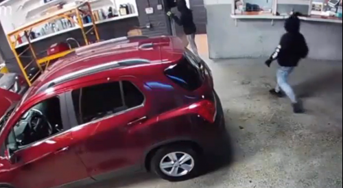Chicago: Surveillance video captured car thieves stealing a vehicle from a auto repair shop