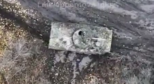 Drone hits a soldier on top of an armored vehicle