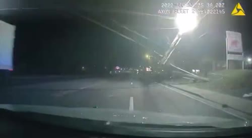 Tennessee: Cookeville truck driver plows through downed power lines, narrowly misses officer