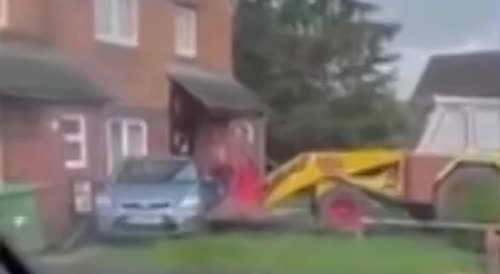 JCB digger rams into house and car in bizarre street rampage