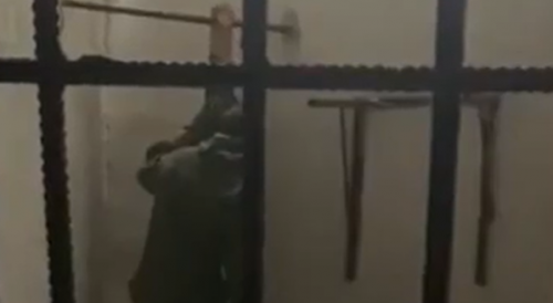 Soldiers torturing a Belarusian fighter who was caught deserting