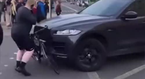 Man runs over a bike with the cyclist escaping narrowly