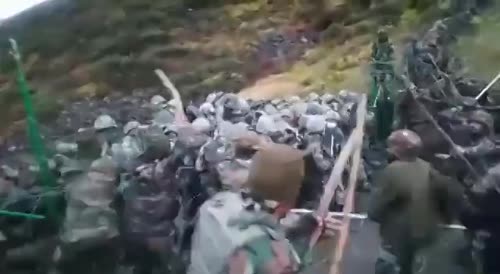 Indian and Chinese troops fight with sticks and bricks