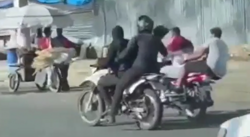 Dominican Police Agents Bash Suspects On Motorcycle With A Helmet Till They Fall