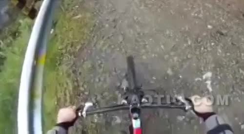 Biker goes flying off of a cliff.