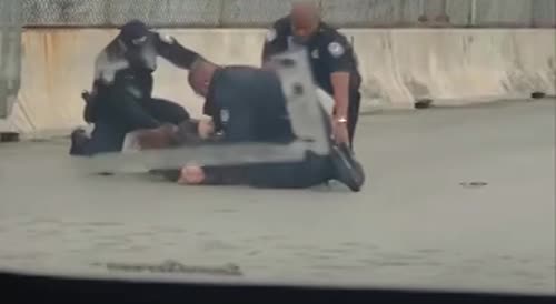 Cop slams a woman on the ground after she attacked him
