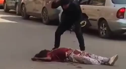 Crazy man in Egypt murders man in the street with a machete