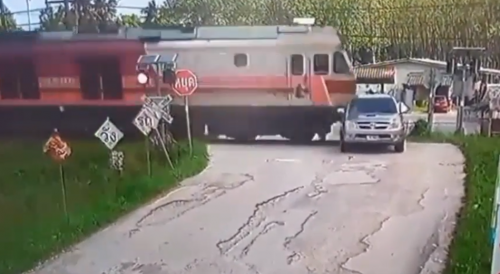 Truck Meets The Train In Thailand