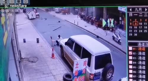 Door goes flying after explosion, clocking rider on it's way by in China.