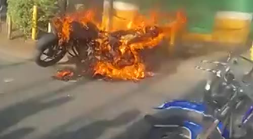 Kenyan Phone Snatcher Beaten, His Bike On Fire