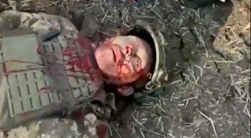 Captured Ukrainian tank and dead Ukrainian soldier