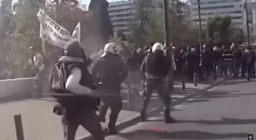 Hellenic Police riot squad gets kicked by a farmer