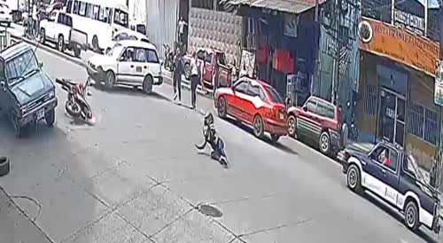 Man flies through the air after crashing into a taxi with his motorcycle