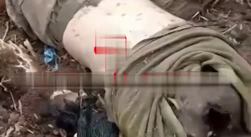 Russian soldiers pull out the corpses of Ukrainian militants