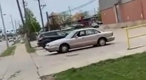 Bystander gets shot at twice by afro woman after a verbal fight