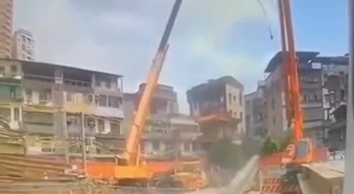 Construction worker gets squished by a beam.