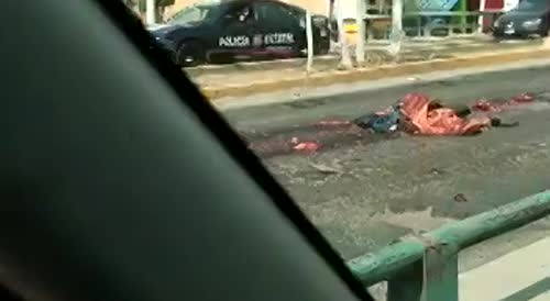 Another Angle Of Biker Turned Into Road Pizza In Mexico