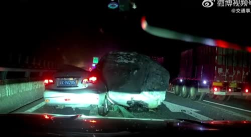 Semi Breaks Suddenly And Loses Giant Bolder, Rolls Over Car
