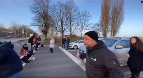 GERMAN GUY SLAPS PROTESTER WHO'S MAKING PEOPLE LATE FOR WORK