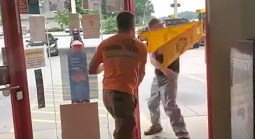 Fight at Gas Station Leads to Destruction of Floor Mop Sign