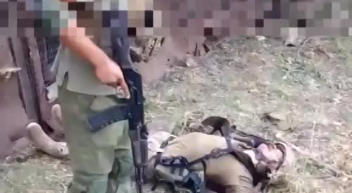 Wagner soldiers kick the corpses of Ukrainians