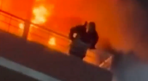 Two jump from a high rise fire, trying to stay alive.