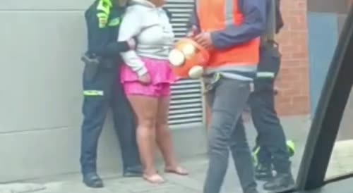 Colombian cop arreste drunk woman