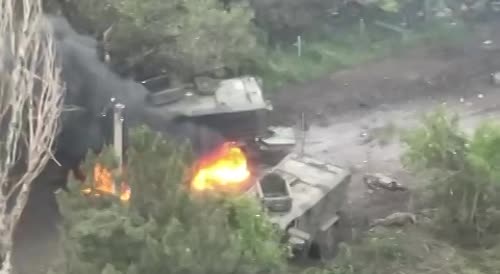 Russian tank destroys American armored vehicles, with Ukrainians