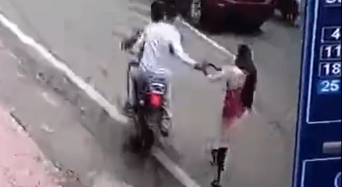 Purse Snatchers Drag A Girl In India