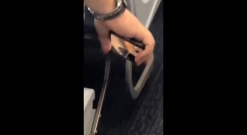 Pervert Caught Filming Up Airline Attendant's Skirt