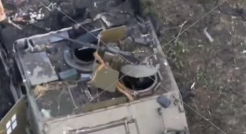 The corpses of Ukrainians, next to the destroyed NATO armored vehicles
