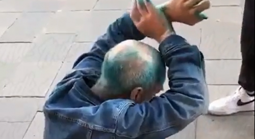 Accussed Of Stealing Booze Hobo Gets Painted In Green