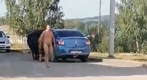 Naked Man Walks With A Pistol Somewhere In Russia