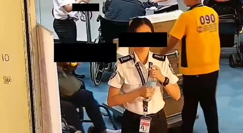 A screening officer of the Philippines' Office of Transportation Security steals money