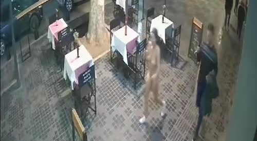 Woman walking naked caught on CCTV