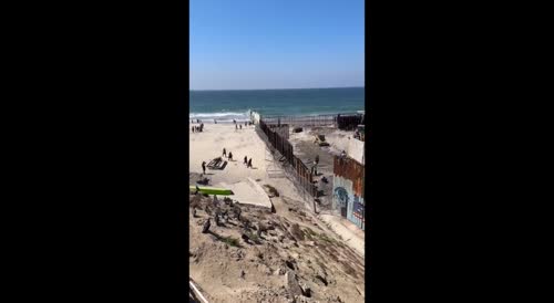 Illegal Immigrants Cross Tijuana/San Diego Beach Border Wall During Repairs