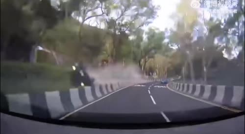 Dashcam shows the speeding car bursting into flames when going around a bend