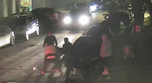 Chicago -neon-vested "peacekeeper" helping a group attack and rob a driver
