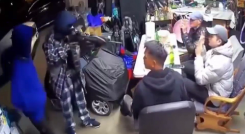 Tacoma, WA:  masked men robbing residents in garage at gunpoint