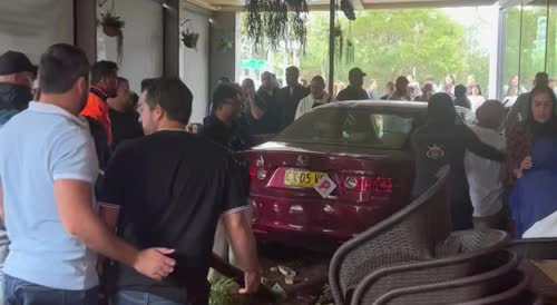 Car crashes into cafe injuring 4 people